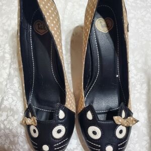 T.U.K Women's Black and Tan Cat Face Heels with creamy white polka dots.